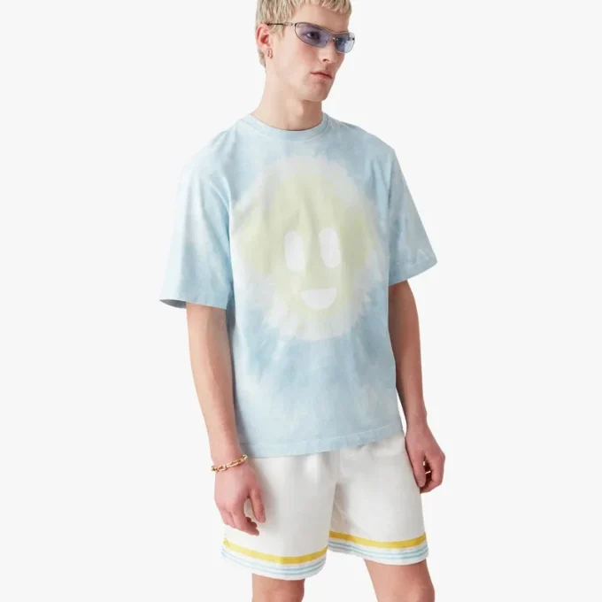 Blaues Oversized-T-Shirt mit kurzen Ärmeln und CC-Smile-Motiv im Tie-Dye-Look Blaues Oversized-T-Shirt mit kurzen Ärmeln und CC-Smile-Motiv im Tie-Dye-Look