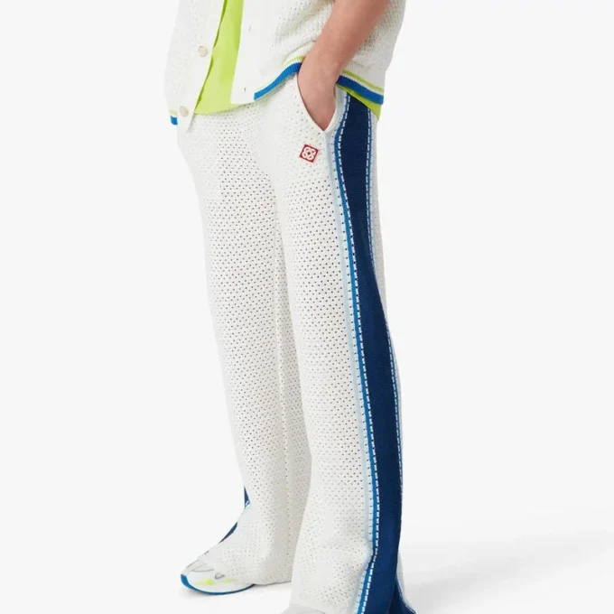 Weiß-blau gestreifte Mesh-Jogginghose Weiß-blau gestreifte Mesh-Jogginghose